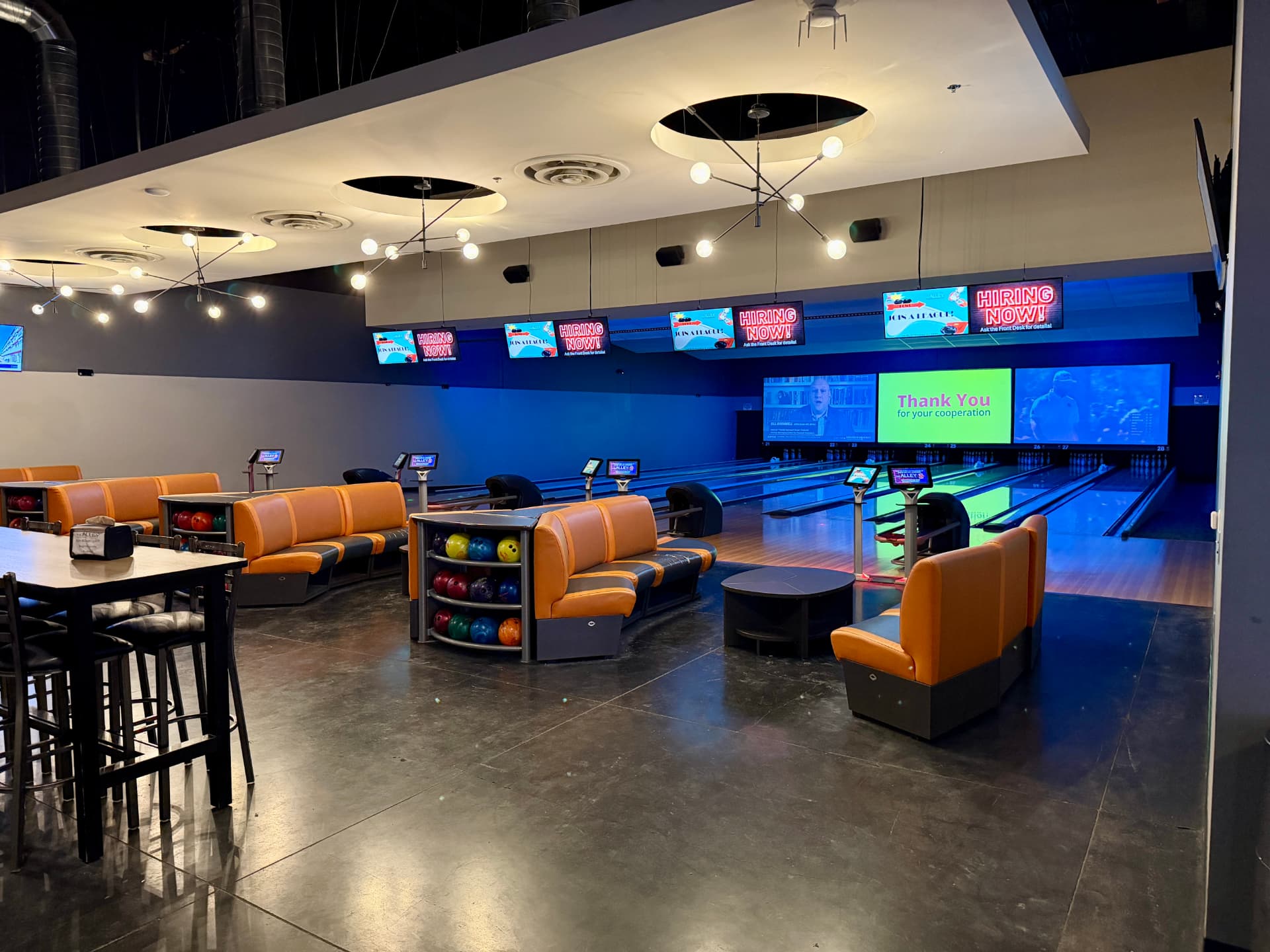 Back Alley lanes 21–28 with lounge seating and big screens